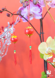 Red Lantern Orchid Arrangement in a Brown Pot